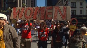 A march for International Women's Day takes place in San Diego, March 8, 2016. 