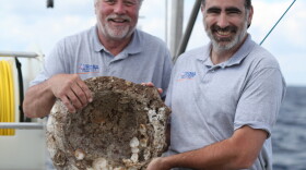 Craig Mullen and Timmy Gambin with a Roman mortar from 1st century BC, from "Secrets Of The Dead: Lost Ships Of Rome." 