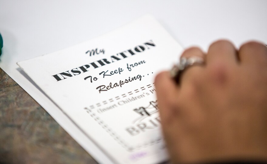 A court booklet give parents inspiration to stay off drugs. They paste a photo of their child on the front and then write about their experiences inside.