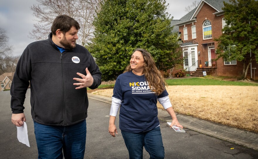 Nicole Sidman and Sam Spencer, her campaign manager, canvass door-to-door in the suburbs of Charlotte, N.C., ahead of Super Tuesday. Sidman is running for North Carolina House District 105.