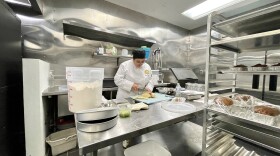 Vichit Vannarath preps potatoes for daily entrees in the kitchen at California Culinary Arts Institute in Barrio Logan, San Diego, Calif., Jan. 19, 2023.