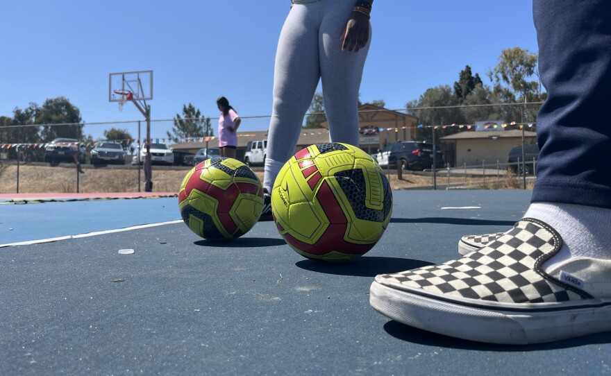 Players stand next to soccer balls on the basketball courts at Colina Del Sol Park, July 10, 2025.