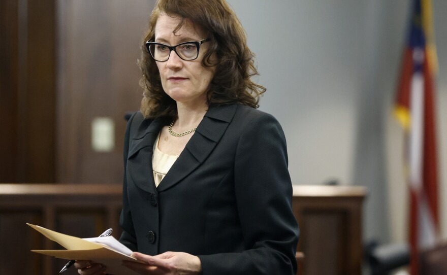 Prosecutor Linda Dunikoski gestures as she speaks during jury selection at Glynn County Superior Court. The court called up to 1,000 prospective jurors to ultimately choose a panel of 16 to hear the case.