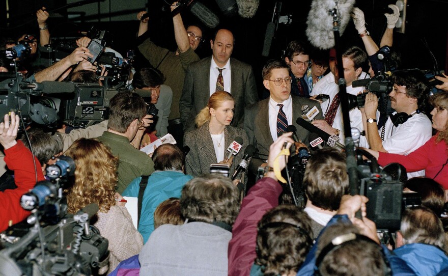 Photographers and reporters beset Harding and her lawyer outside the district attorney's office in Portland, Ore., in 1994, after the attack on Kerrigan.