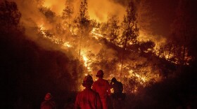 Firefighters monitor a backfire while battling the Ranch Fire, part of the Mendocino Complex Fire, on Tuesday, Aug. 7, 2018. 