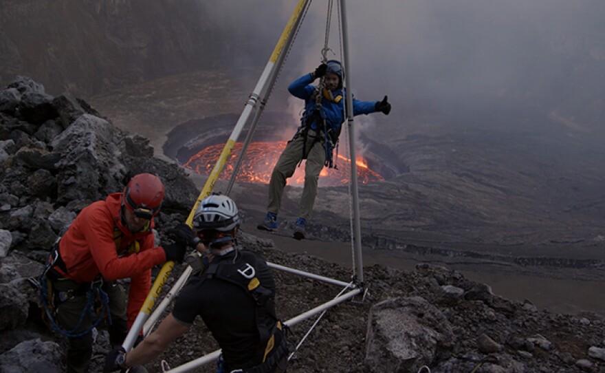 Jeff Johnson descending into crater. The Virunga mountains in the Democratic Republic of Congo are home to two of the most dangerous, spectacular, and least understood volcanoes in the world.