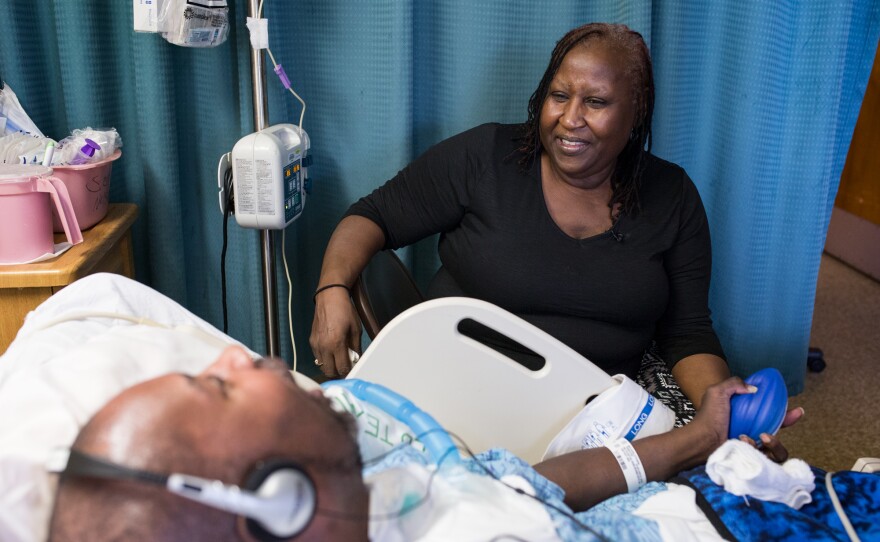 Gloria Hawkins sitting next to her son at the Villa Coronado Skilled Nursing Facility