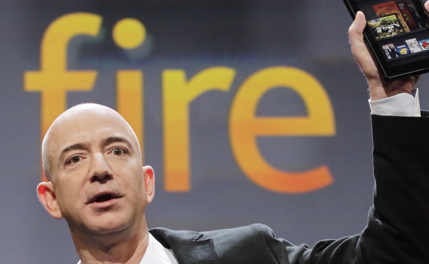 Amazon CEO Jeff Bezos, pictured at a 2011 news conference, is portrayed as the mastermind behind the company's rigid workplace culture in a New York Times article.