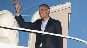 President Barack Obama waves as he steps out of Air Force One at Marine Corps Air Station Miramar in San Diego, Oct. 10, 2015.