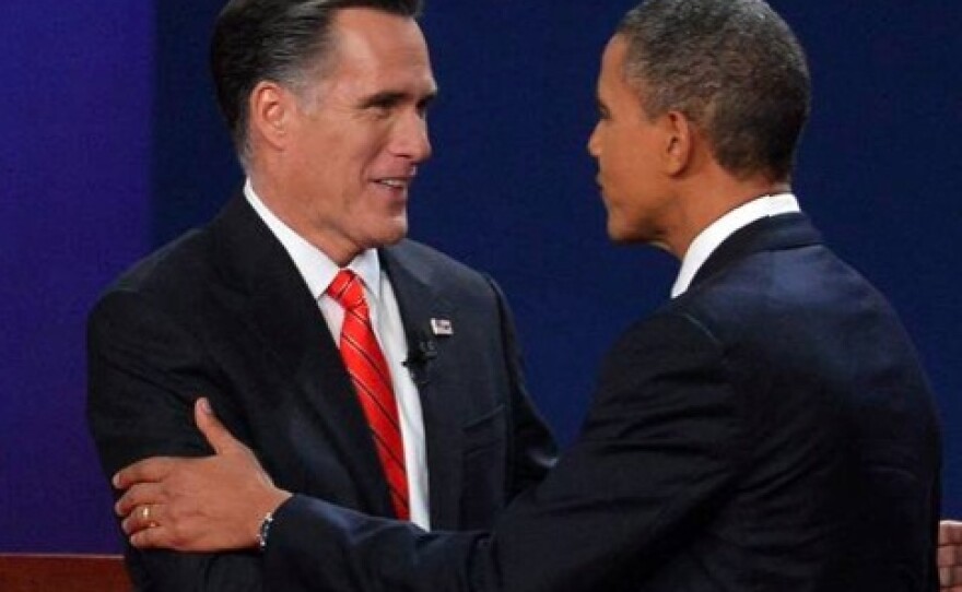 US President Barack Obama (R) and Republican Presidential candidate Mitt Romney (L) shake hands moments before the start of the first presidential debate at Magness Arena at the University of Denver in Denver, Colorado, October 3, 2012. 