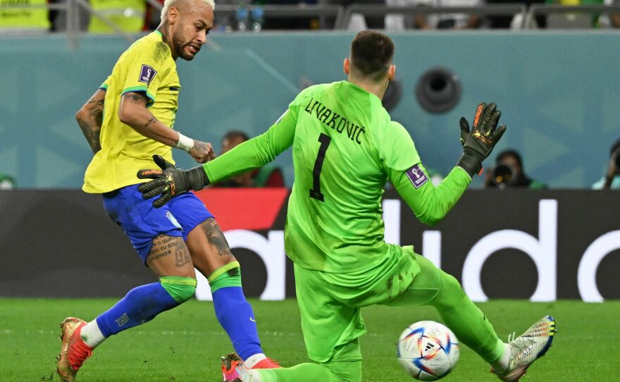 Croatia goalkeeper Dominik Livaković snuffs out Brazil forward Neymar during the World Cup quarterfinal match on Dec. 9, 2022.