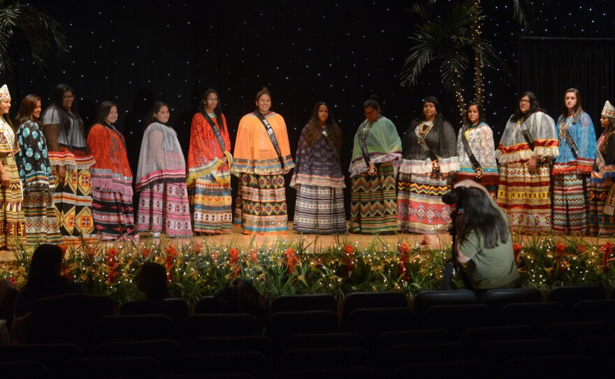 All twelve contestants for the Jr. Miss Florida Seminole Princess and Miss Florida Seminole Princess titles line up at dress rehearsal in Hollywood, Fla. The Seminole patchwork patterns have a Pop-art, kinetic quality, especially dramatic when side-by-side.