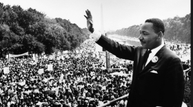 Martin Luther King Jr. is shown waving to attendees at the The March on Washington in 1963.