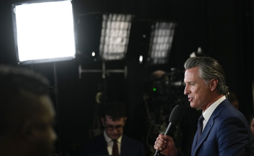 California Gov. Gavin Newsom speaks to reporters in the spin room before a presidential debate between Republican presidential nominee former President Donald Trump and Democratic presidential nominee Vice President Kamala Harris, Tuesday, Sept. 10, 2024, in Philadelphia.