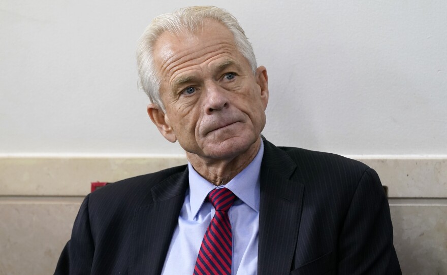 File photo of White House trade adviser Peter Navarro listening as President Donald Trump speaks during a news conference at the White House, on Aug. 14, 2020, in Washington.