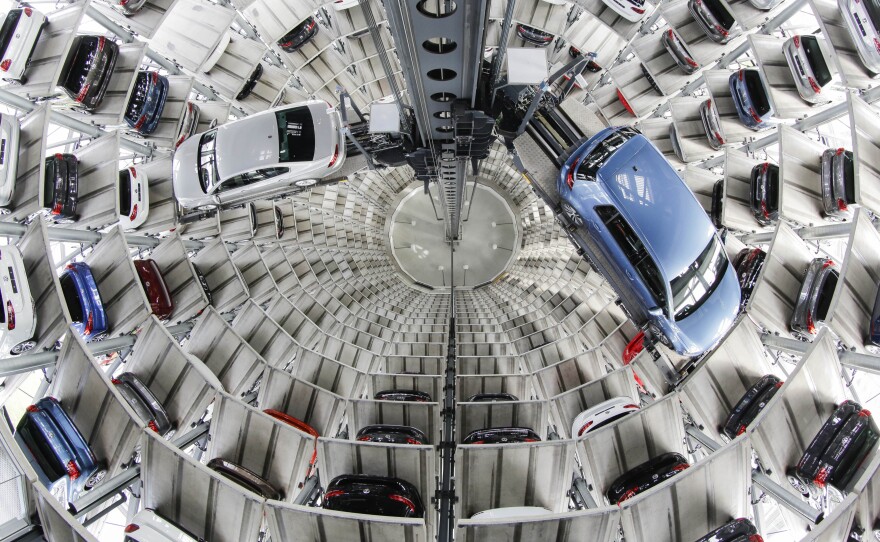 Volkswagen used six different "defeat devices" to purposefully skirt U.S. emissions rules, new lawsuits say. Here, VW cars are seen in a delivery tower in Wolfsburg, Germany, earlier this year.