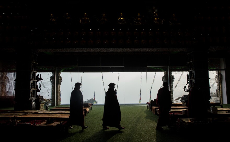 Nuns walk around a holy object — a practice known as kora — as part of their morning meditation.
