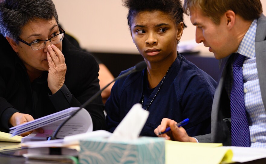 Chrystul Kizer (shown here with her lawyers in 2019) is arguing that it was self-defense when she killed the man who sexually abused her.