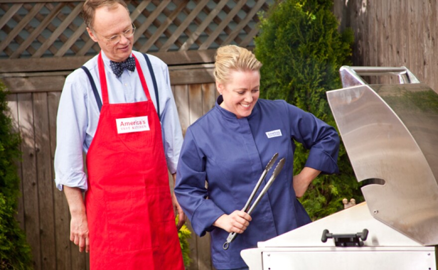 Host Christopher Kimball and test kitchen cook Julia Collin Davison at the grill.
