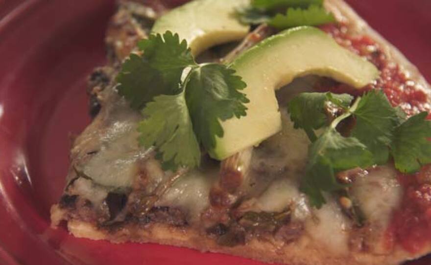 A blending of two cultures—Mexican and Americana—with a dish of carne asada and cebollitas pizza.