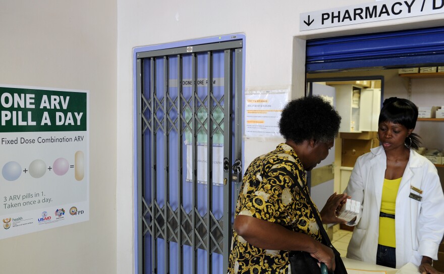A woman receives medication at a clinic offering antiretroviral drugs for HIV patients in Ga-Rankuwa, South Africa.