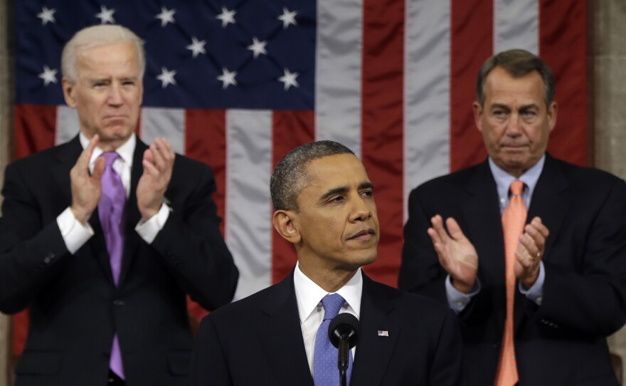Vice President Biden and House Speaker John Boehner of Ohio applaud President Obama as he gives his State of the Union address during a joint session of Congress on Feb. 12, 2013.