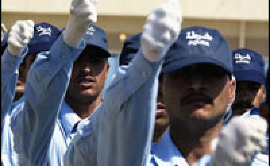 Iraqi police cadets march at a graduation ceremony at the Baghdad Police Academy, June 29, 2006.