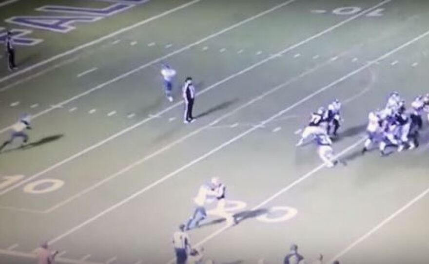 A screengrab shows the moment before two high school football players hit a back judge during a game in Texas this weekend.