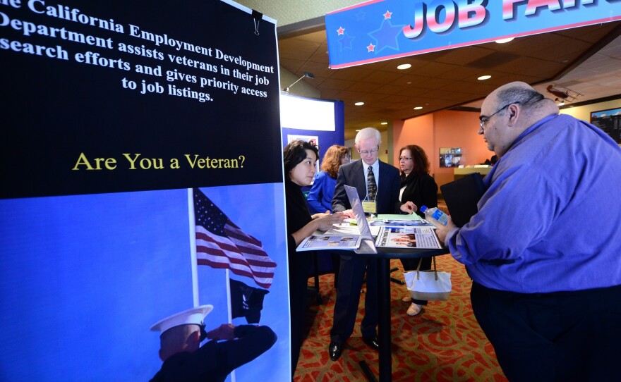 A prospective job seeker gets information at a job resource fair for military veterans in Van Nuys, Calif., on Oct. 24.