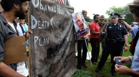 Police work to keep control of protesters at Portsmouth High School in in Portsmouth, N.H., Tuesday, Aug. 11, 2009, where President Obama spoke about his health care plan.