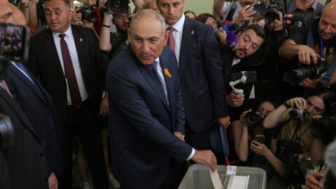 Armenian Prime Minister Nikol Pashinyan, center, casts his ballot at a polling station during the parliamentary election in Yerevan, Armenia, Sunday, June 7, 2026.