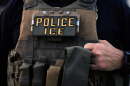A U.S. Immigration and Customs Enforcement agent is seen in Park Ridge, Ill., Sept. 19, 2025.