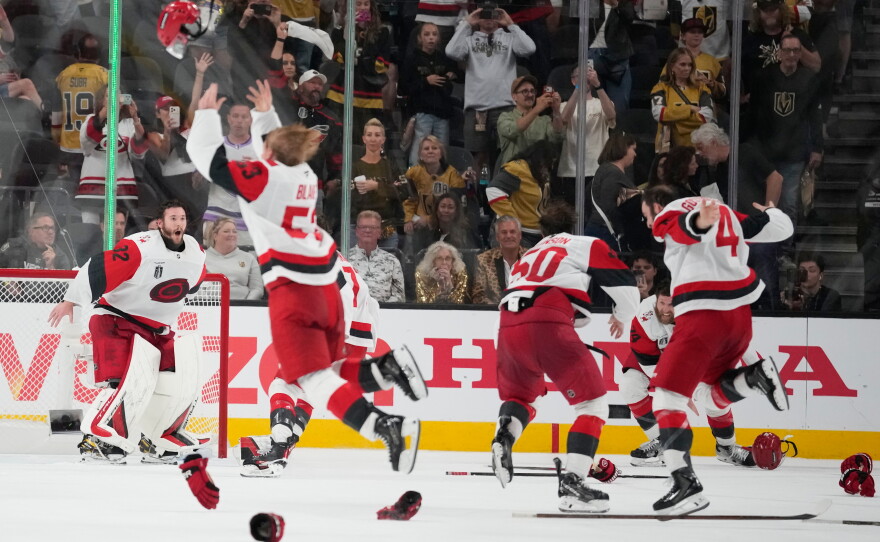 The Carolina Hurricanes celebrates after a win over the Vegas Golden Knights in Game 6 of the NHL hockey Stanley Cup Final series against the Vegas Golden Knights, Sunday, June 14, 2026, in Las Vegas.