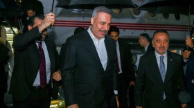 In this photo released by the Pakistan Ministry of Foreign Affairs, Turkish Foreign Minister Hakan Fidan, center, walks toward his car upon arrival to attend a meeting in Islamabad, Pakistan, Saturday, March 28, 2026.