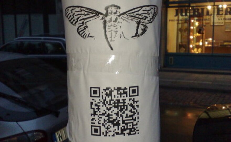 A poster found in Warsaw shows a QR Code for a website related to the Cicada 3301 mystery.