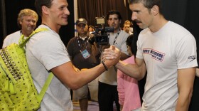 A beautiful bro-ment: Ryan Lochte and Michael Phelps give each other the traditional arm-wrestle bro-shake at the U.S. Olympic swimming trials in June 2012.