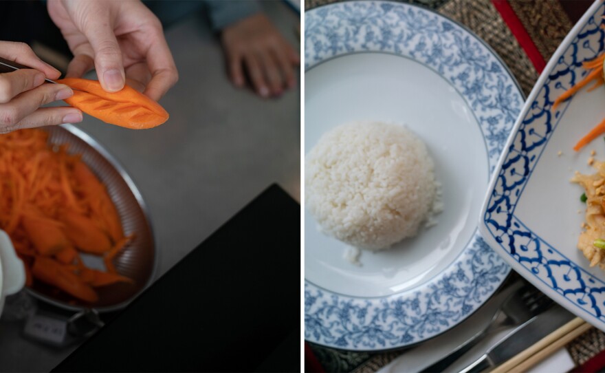 One of Paprajong's daughters carves a carrot in preparation for the evening (left). Plates of rice and Pad Thai (right).