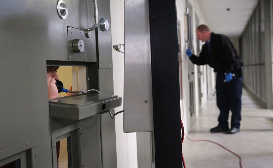 The U.S. holds more prisoners in solitary confinement than any other democratic country, according to critics of the treatment. Here, an immigrant detainee makes a call from his "segregation cell" at a detention facility in Adelanto, Calif., last November.