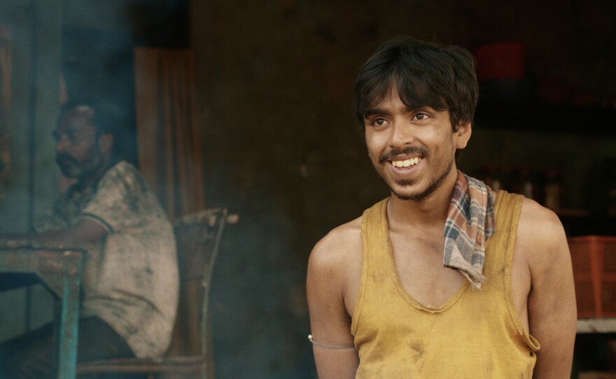 He is "the white tiger" — a poor villager, Balram, portrayed by actor Adarsh Gourav, who is determined to use his intelligence to escape a life of poverty.