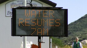 Sign at Lake Poway reading "Water resumes 7 a.m." Dec. 2, 2019.