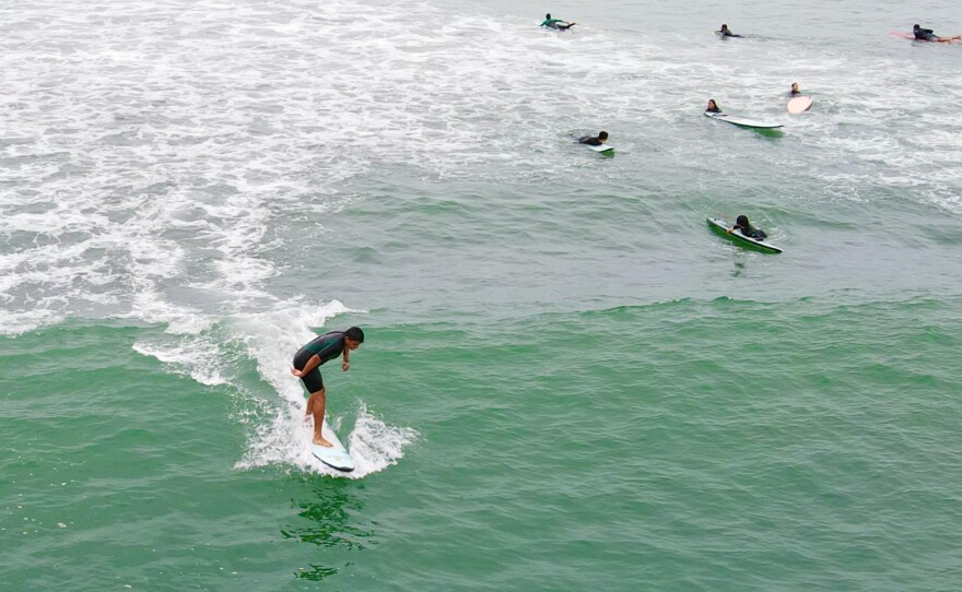 Alto Peru students surfing. "It has changed my life," says Omarion Butler, 19, who began surfing with Waves for Hope two years ago. "When my parents put me down in the past, it was hard for me to interrogate my feelings. But surfing makes me more confident. It helps me to take five, take time for myself."