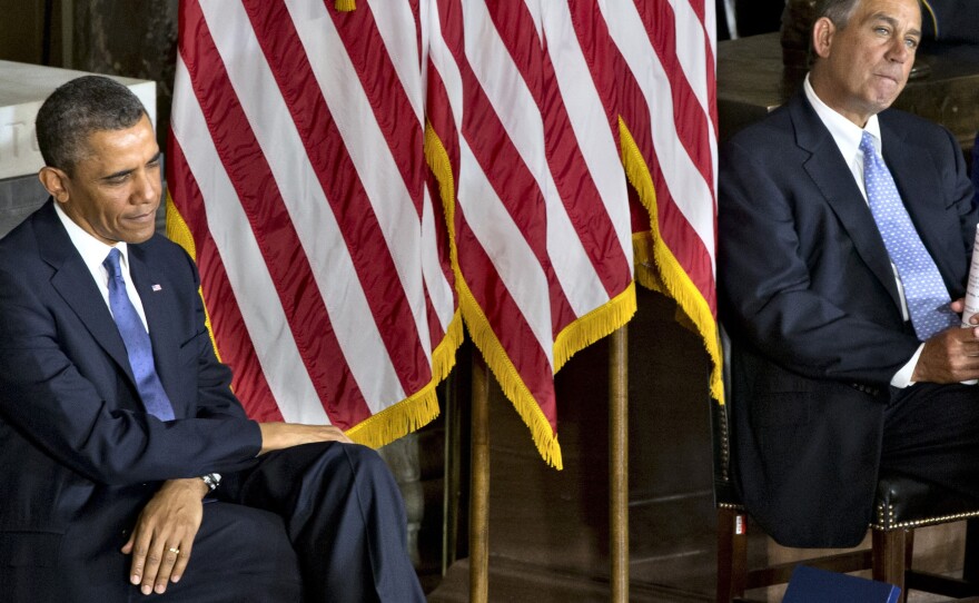 President Obama and House Speaker John Boehner sit together at a Capitol event in February dedicating a statue of civil rights icon Rosa Parks.