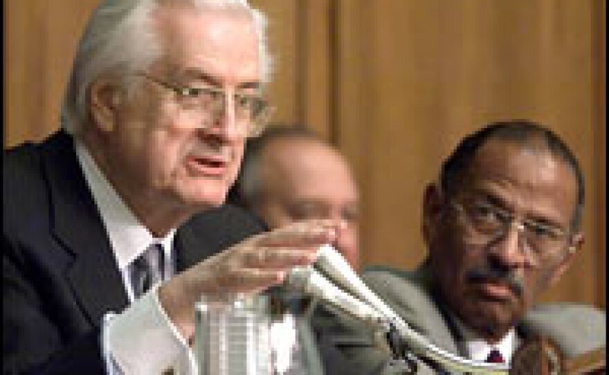 House Judiciary Chairman Henry Hyde (left) speaks during impeachment proceedings Oct. 5, 1999, as ranking minority member Rep. John Conyers (D-MI) looks on.