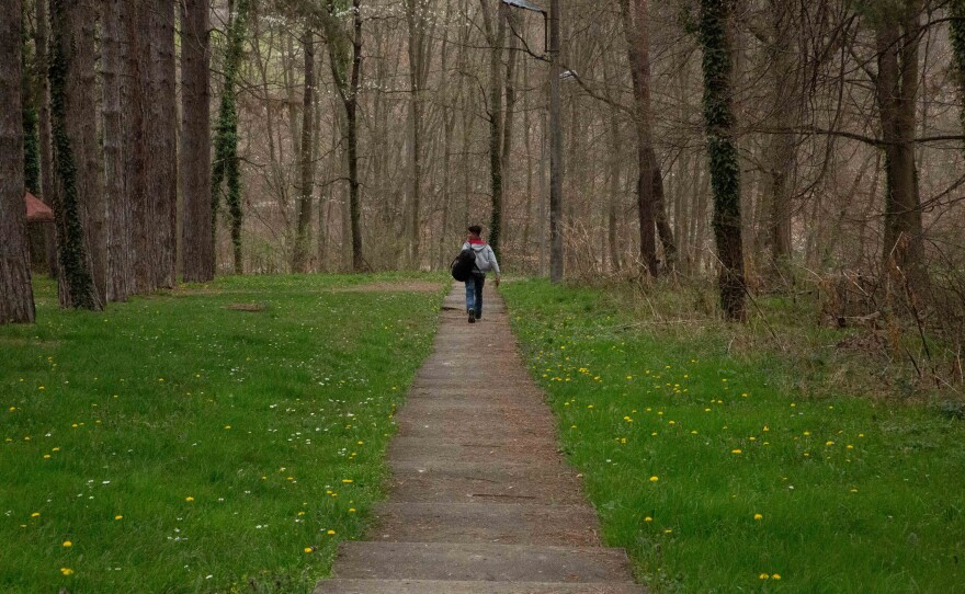 An unaccompanied minor leaves the premises of the asylum center in Bogovadja, Serbia, to try to cross into a neighboring EU country.