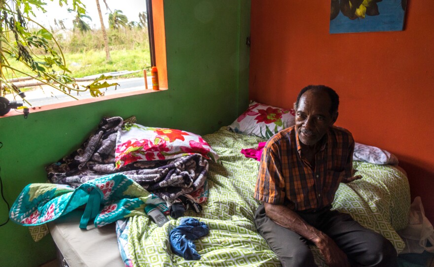 Santiago Quiñones Escalera, 73, sits on an air mattress he and his wife are sleeping on in Loiza , Puerto Rico, which sustained heavy damage by the destructive path of Hurricane Maria. Quiñones owns the bar/restaurant in front of the ocean and he decided he and his wife should ride the storm out there. Fortunately the building held up. They use a generator and solar-powered lighting.