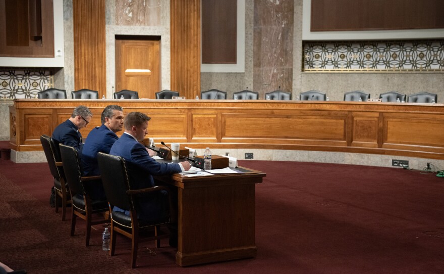 From l-r., Chairman of the Joint Chiefs of Staff Air Force Gen. Danial Caine, Secretary of Defense Pete Hegseth, and acting undersecretary of defense during the Senate Armed Services Committee hearing on the Department of Defense budget, on Capitol Hill, in Washington, Thursday, April 30, 2026.