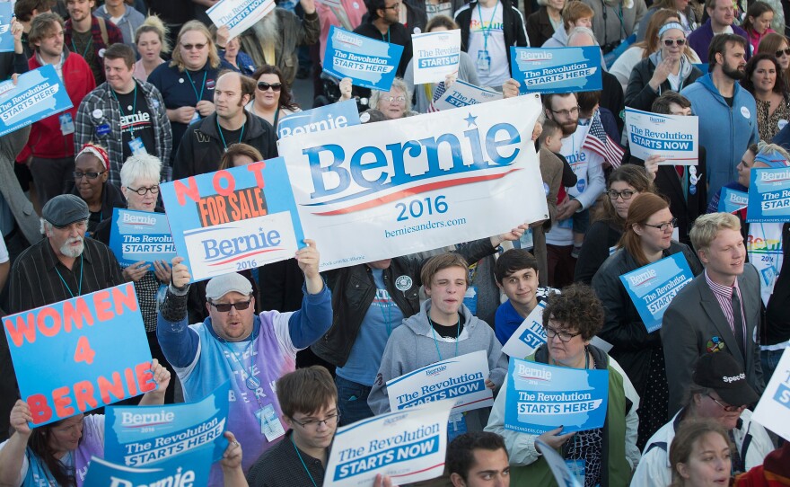 Bernie Sanders supporters walk to the Iowa Events Center before the Jefferson-Jackson dinner in October in Des Moines.