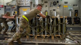Troops at Dover Air Force Base in Delaware load pallets of ammunition onto an aircraft bound for Ukraine Aug. 9, 2022.
