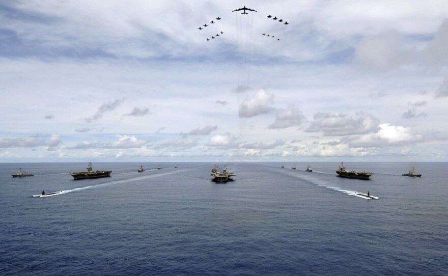 The USS Nimitz, USS Kitty Hawk and USS John C. Stennis carrier strike groups travel in formation during an exercise in 2007 in the Guam operating area.