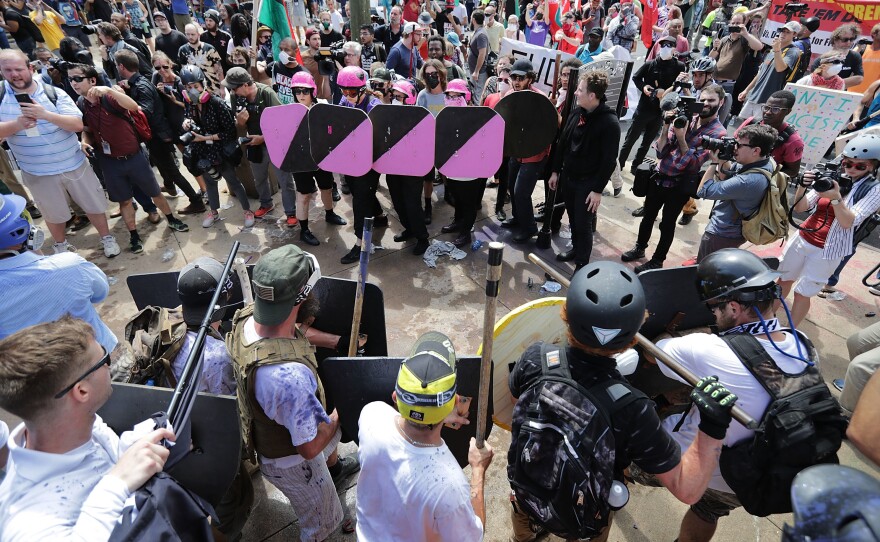 Far-right demonstrators and counterprotesters face off at the entrance to Emancipation Park (now named Market Street Park) in Charlottesville, Va., during the Unite the Right rally in August 2017.